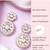 Women gold finish earrings featuring sparkling diamond embellishments