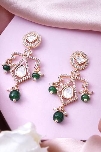 Women bold kundan earrings featuring uncut and kundan stonework