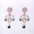 Women bold kundan earrings featuring uncut and kundan stonework