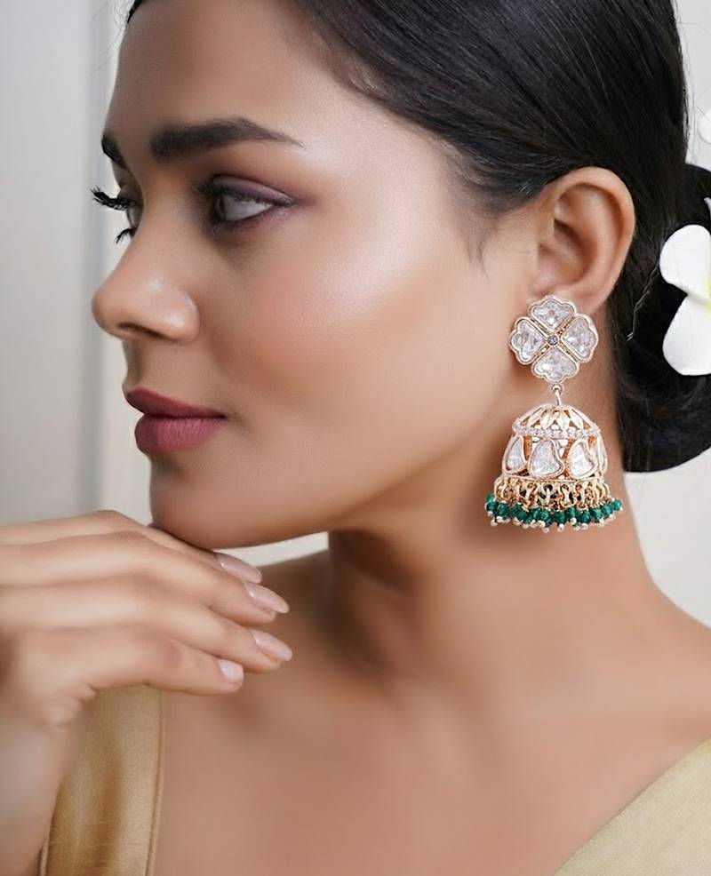 Women traditional green buttalu earrings with elegant detailing