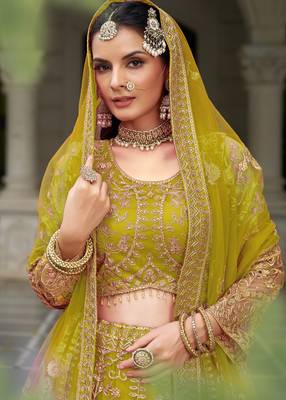 bridal wear yellow net lehenga choli embroidery stone work 2