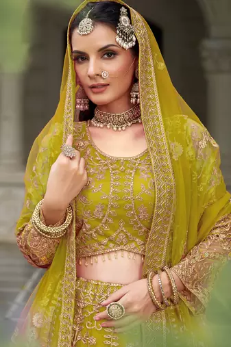 bridal wear yellow net lehenga choli embroidery stone work