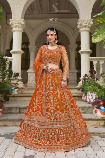Indian wedding bridal wear orange net lehenga choli semi stitched embroidery stone work