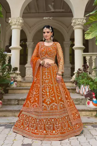 Indian wedding bridal wear orange net lehenga choli semi stitched embroidery stone work