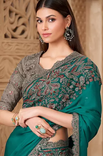 Teal color satin silk blend embroidered border saree