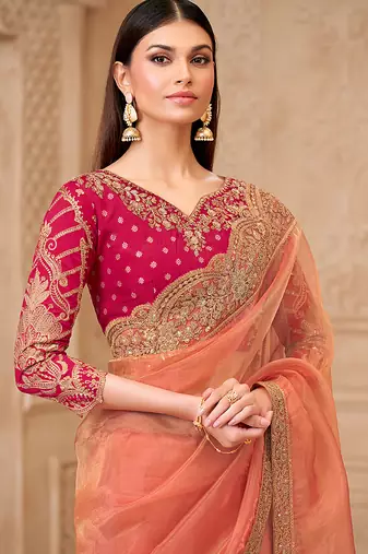 Peach color georgette silk blend embroidered border saree