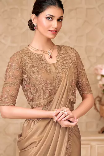 Beige shimmer satin georgette embroidered border saree with jacket style blouse