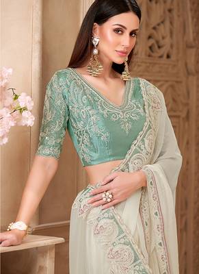 Off white color georgette silk blend embroidered border saree 2
