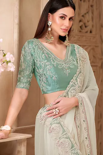 Off white color georgette silk blend embroidered border saree