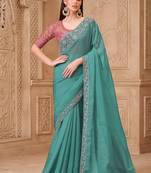 Turquoise color crush satin georgette embroidered fancy designer saree