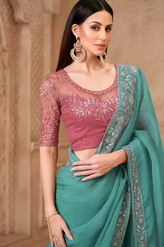 Turquoise color crush satin georgette embroidered saree