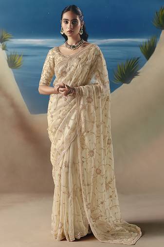 Cream fancy fabric with designer embroidery sequince work saree