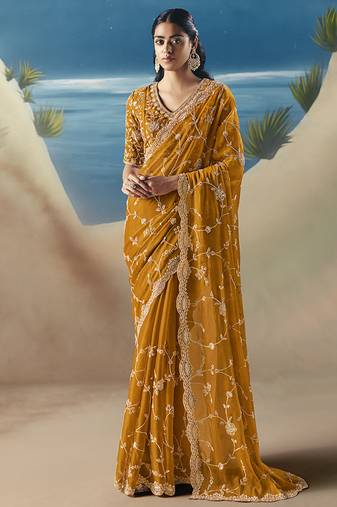 Orange fancy fabric with designer embroidery sequince work saree