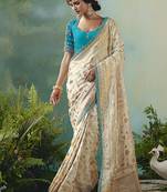 Off white dola viscose silk saree with zari weaving & sequence work blouse