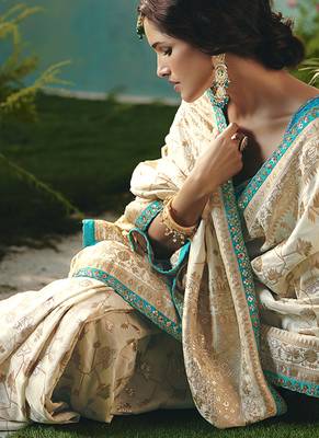 Off white dola viscose silk blend saree with zari weaving & sequence work blouse 3