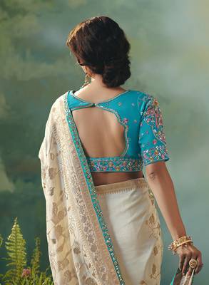 Off white dola viscose silk blend saree with zari weaving & sequence work blouse 4