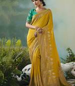 Yellow dola viscose silk saree with zari weaving & sequence work blouse