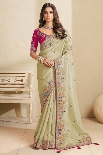 Green party wear tissue saree with designer blouse fabric