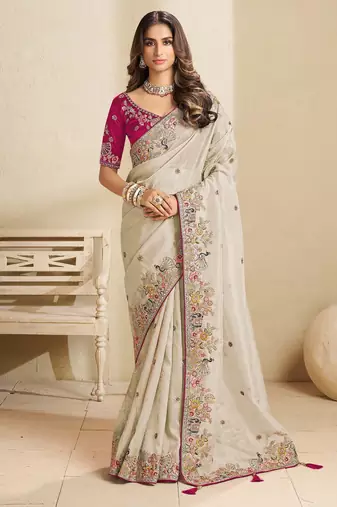 Off-white party wear tissue saree with designer blouse fabric