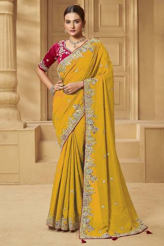 Yellow party wear fancy silk saree with designer blouse fabric