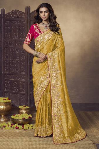 Yellow party wear jecquard saree with designer blouse fabric