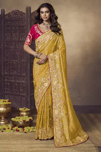 Yellow party wear jecquard saree with designer blouse fabric