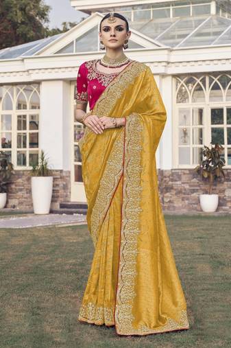 Yellow party wear jecquard saree with designer blouse fabric