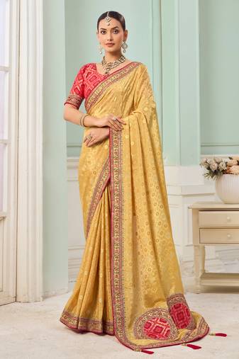 Yellow party wear tissue vicose saree with designer blouse fabric