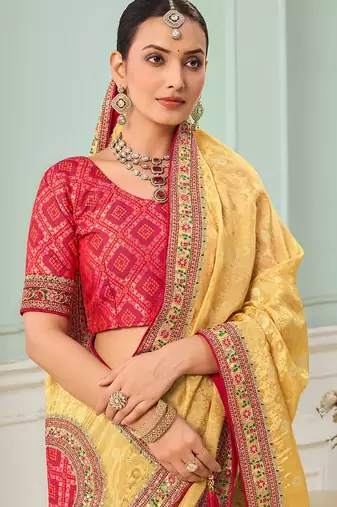 Yellow party wear tissue vicose saree with designer blouse fabric