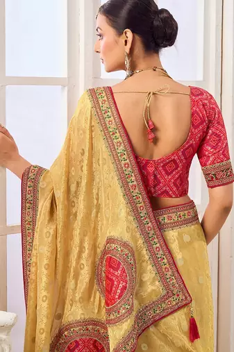 Yellow party wear tissue vicose saree with designer blouse fabric