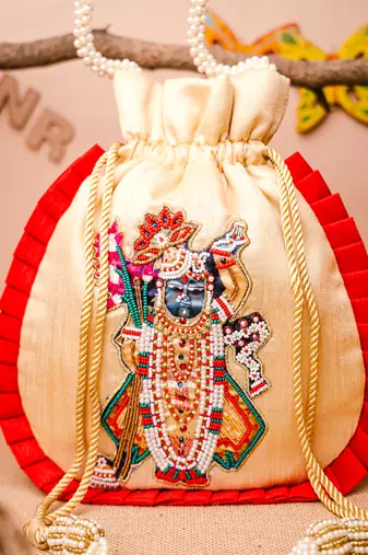 Cream embroidered potli bag