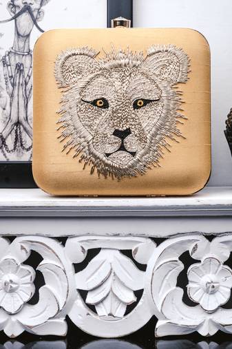 Yellow embroidered clutch