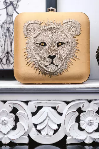 Yellow embroidered clutch