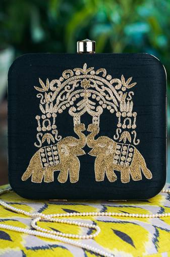 Blue embroidered clutch