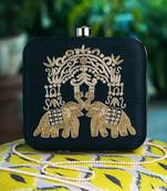 Blue embroidered clutch