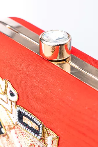Red embroidered clutch