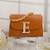 Tan customised 'e' leather clutch