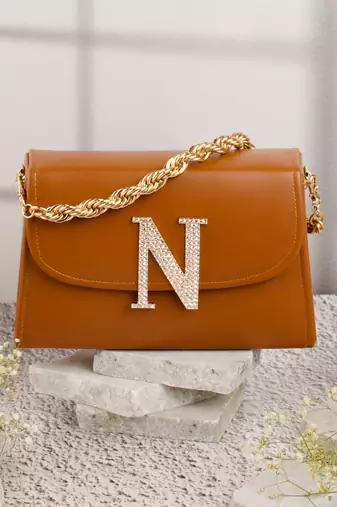 Tan customised 'n' leather clutch