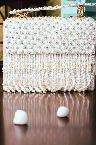 White embroidered clutch