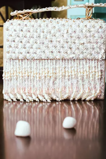 White embroidered clutch