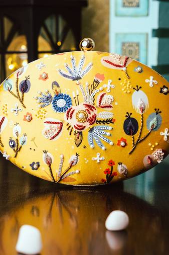 Yellow floral embroidered clutch