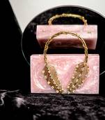 Pink embroidered clutch