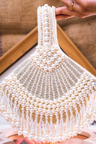 White embroidered pouch bag