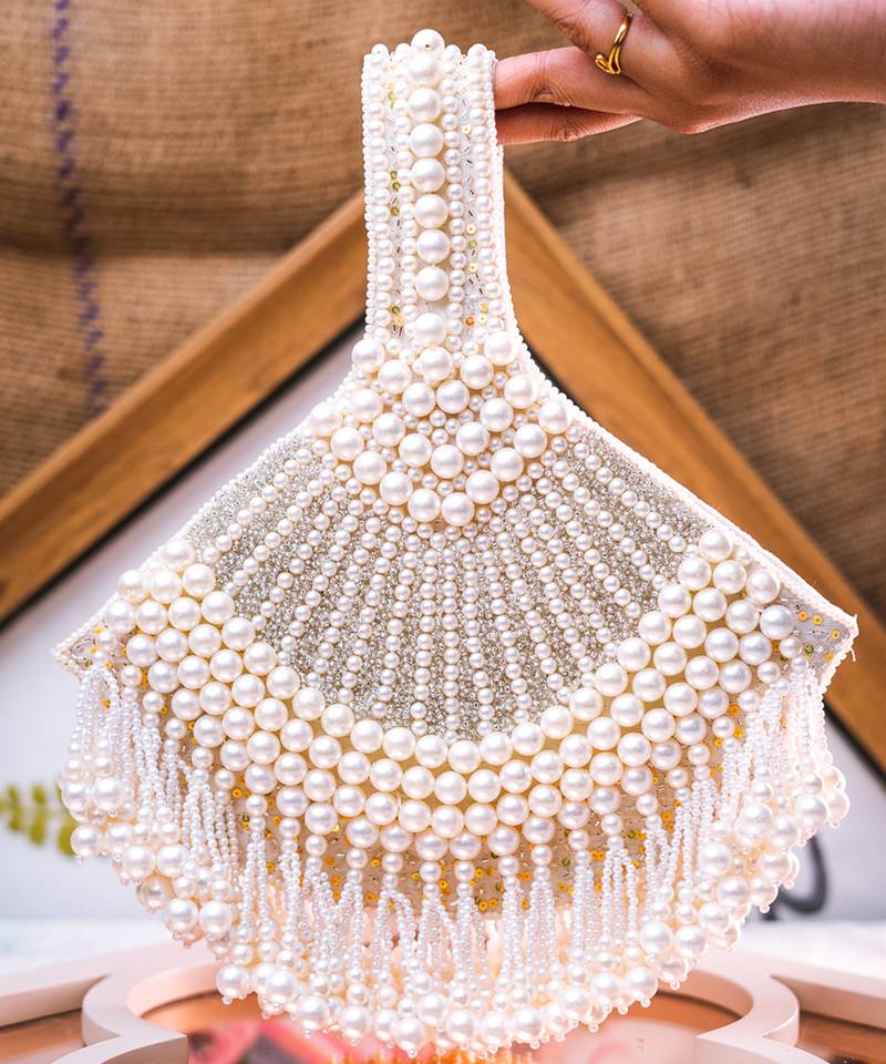 White embroidered pouch bag