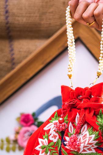 Red embroidered clutch