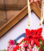 Red embroidered clutch
