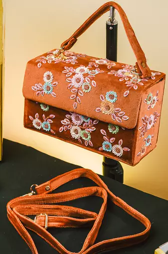 Tan floral embroidered clutch