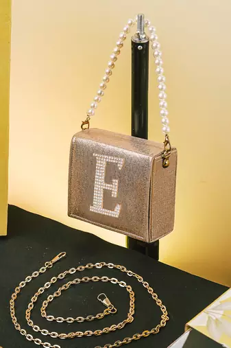 Gold customised 'e' synthetic clutch