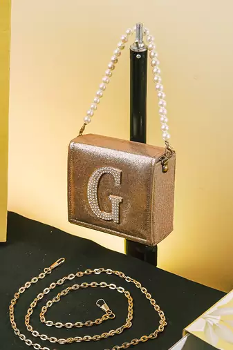 Gold customised 'g' synthetic clutch