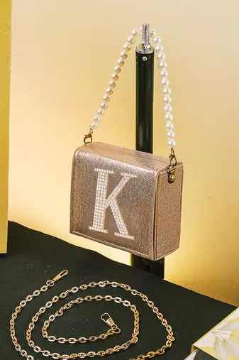 Gold customised 'k' synthetic clutch